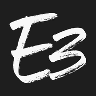 Stylized white E3 logo with a hand-drawn brushstroke texture on a dark gray background.